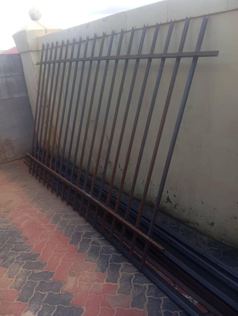 Palisade fencing materials prepared for installation